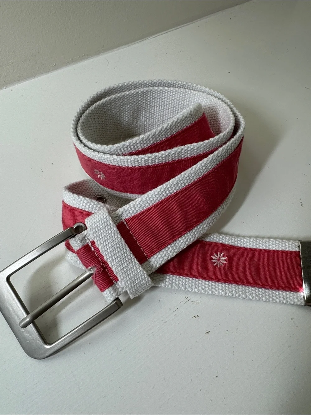 Unbranded coal and white ribboned web belt with silver tone buckle.